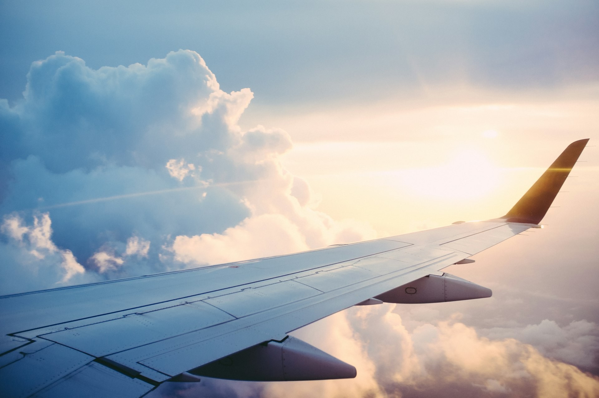 Flight booking - airplane wing view